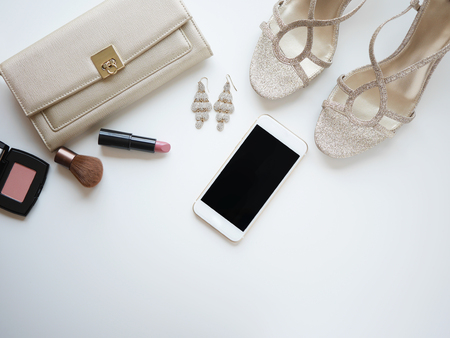 Flat lay woman accessories, elegant items withe cosmetic and mobile phone. isolated.の写真素材