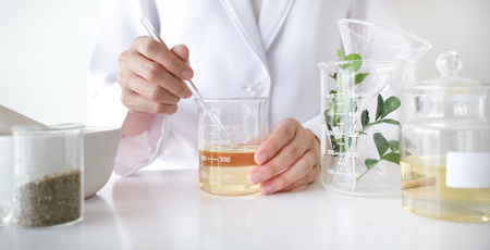 the scientist,doctor, make alternative herb medicine with herbal the organic natural in the laboratory. oil capsule, natural organic skincare and cosmetic.の写真素材