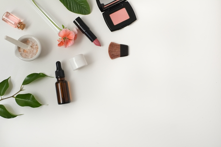 Cosmetic package containers with green leaves, pink salt,herbal . natural  organic beauty product concept mock up. Blank bottle for label own branding skincare. isolated white background.top view.の写真素材
