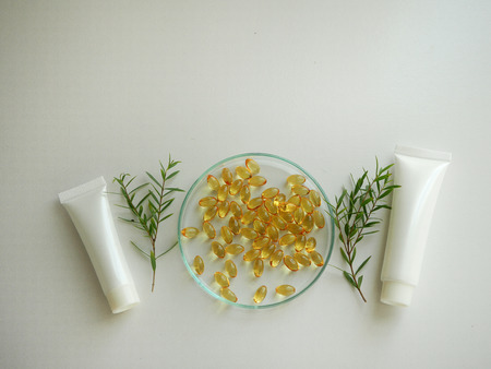 natural cosmetic skincare serum packaging with leaf, home made oil and beauty vitamin ingredient.organic product research the blank bottle container ,bio science . alternative medicine. spa.の写真素材