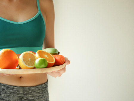 slim woman wear active with beautiful body waist after diet food, weight loss concept and healthy lifestyle.isolated on white with copy space.の写真素材