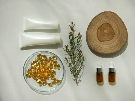 natural cosmetic skincare serum packaging with leaf, home made oil and beauty vitamin ingredient.organic product research the blank bottle container ,bio science . alternative medicine. spa.の写真素材