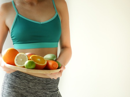 slim woman wear active with beautiful body waist after diet food, weight loss concept and healthy lifestyle.isolated on white with copy space.の写真素材