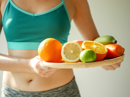 slim woman wear active with beautiful body waist after diet food, weight loss concept and healthy lifestyle.isolated on white with copy space.の写真素材