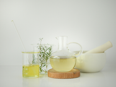 natural cosmetic skincare serum packaging with leaf, home made oil and beauty vitamin ingredient.organic product research the blank bottle container ,bio science . alternative medicine. spa.の写真素材