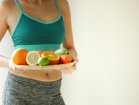slim woman wear active with beautiful body waist after diet food, weight loss concept and healthy lifestyle.isolated on white with copy space.の写真素材