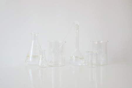 laboratory equipment glassware  for alternative medicine, science experiments, formulating organic skincare, herbal medicine and natural remedy pharmaceutical. white backgroundの写真素材