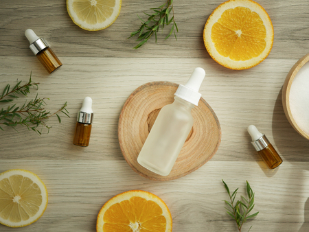 natural cosmetic skincare serum packaging with leaf, home made oil and beauty vitamin ingredient.organic product research the blank bottle container ,bio science . alternative medicine. spa.の写真素材