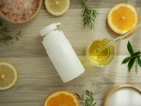 natural cosmetic skincare serum packaging with leaf, home made oil and beauty vitamin ingredient.organic product research the blank bottle container ,bio science . alternative medicine. spa.の写真素材