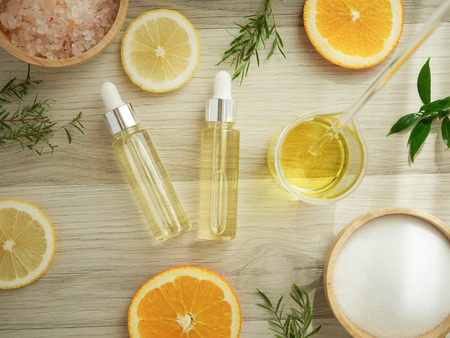 natural cosmetic skincare serum packaging with leaf, home made oil and beauty vitamin ingredient.organic product research the blank bottle container ,bio science . alternative medicine. spa.の写真素材