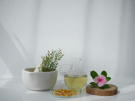 natural cosmetic skincare serum packaging with leaf, home made oil and beauty vitamin ingredient.organic product research the blank bottle container ,bio science . alternative medicine. spa.の写真素材