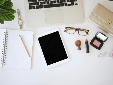 flat lay woman workplace with laptop ,smart phone, tablet and  accessories, top view,isolated の写真素材