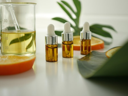 Cosmetic package containers . natural organic beauty product concept mock up with green leaves,herbal . Blank bottle for label skincare. isolated white background.top view.の写真素材