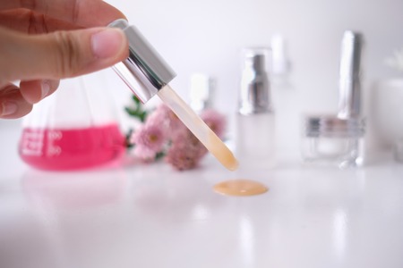 cosmetic skincare beauty product .natural organic flower oil ingredient in the laboratory. packaging spa concept.の写真素材
