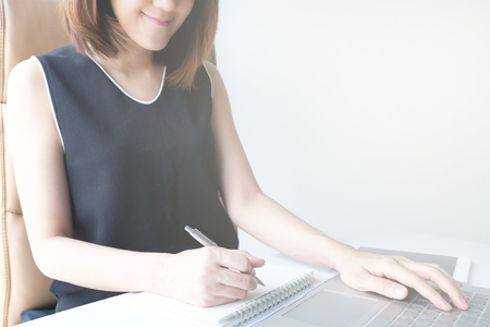 young asian woman work and e learning . online working business in office. blog.の写真素材