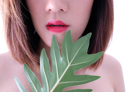Young beautiful woman applying make up.の写真素材