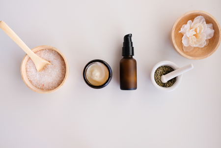Beauty cosmetic skincare background .Products with flower ,leaves on table top view, flat lay.minimal modernの写真素材