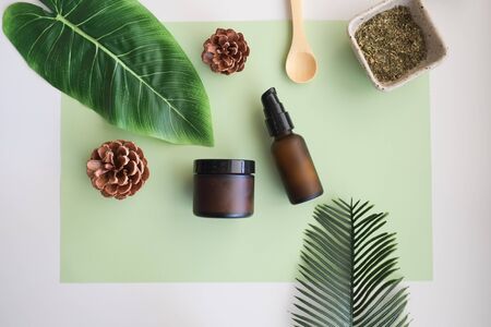 Beauty cosmetic skincare background .Products with flower ,leaves on table top view, flat lay.minimal modernの写真素材