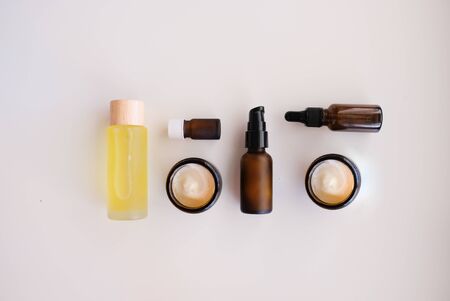 Beauty cosmetic skincare background .Products with flower ,leaves on table top view, flat lay.minimal modernの写真素材