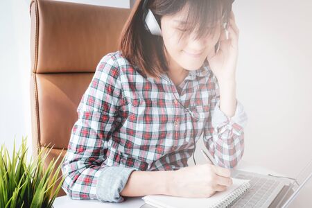 young asian woman work and e learning . online working business in office. blog.の写真素材