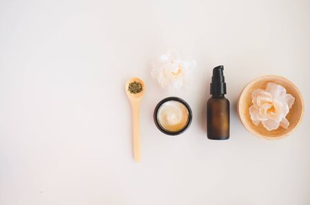 Beauty cosmetic skincare background .Products with flower ,leaves on table top view, flat lay.minimal modernの写真素材