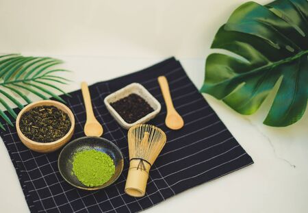 matcha green tea and bamboo whisk on white background. tradition japanese tea ceremonial.の写真素材