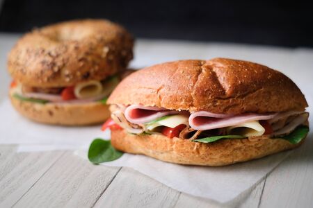 Delicious classic blt sandwiches with ham, cheese, bacon, tomatoes. Breakfast and fast food meal. on isolated black background wooden and text copy space.の写真素材