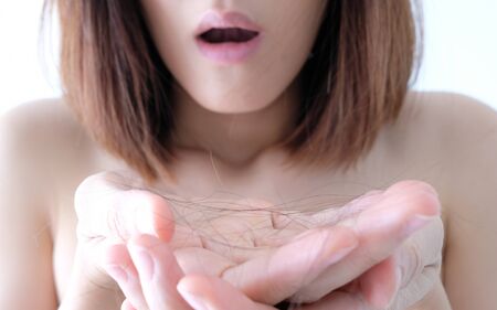 Young beautiful asian woman applying make up. cosmetic beauty conceptの写真素材