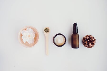 Beauty cosmetic skincare background .Products with flower ,leaves on table top view, flat lay.minimal modernの写真素材