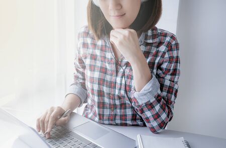 young asian woman work and e learning . online working business in office. blog.の写真素材