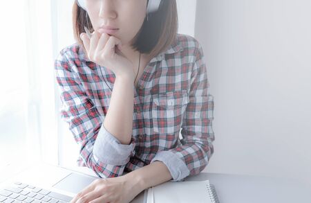 young asian woman work and e learning . online working business in office. blog.の写真素材