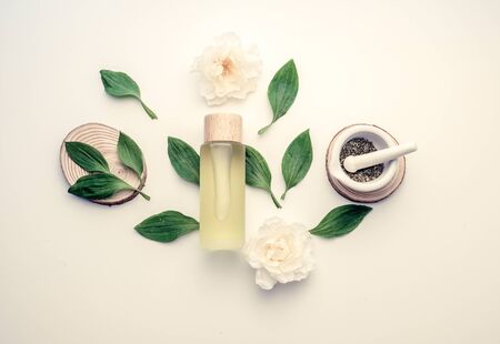 natural cosmetic cream , serum, skincare blank bottle packaging with leaves herb, wood . bio organic product.beauty and spa concept.の写真素材