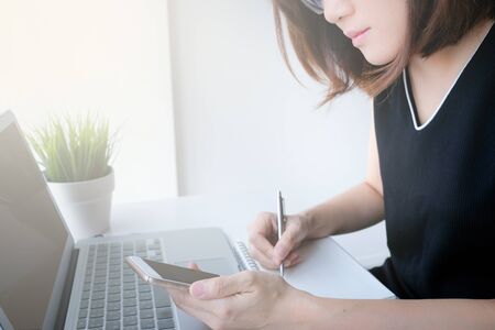 young asian woman work and e learning . online working business in office. blog.の写真素材