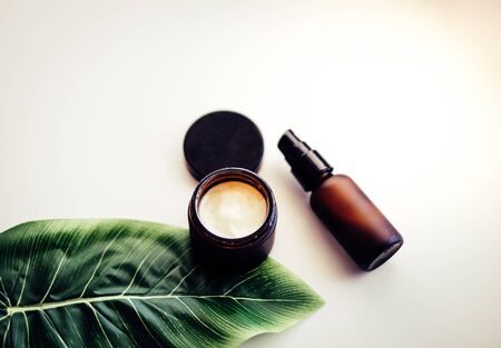 Beauty cosmetic skincare background .Products with flower ,leaves on table top view, flat lay.minimal modernの写真素材