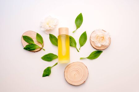 natural cosmetic cream , serum, skincare blank bottle packaging with leaves herb, wood . bio organic product.beauty and spa concept.の写真素材