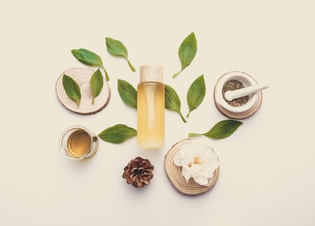 natural cosmetic cream , serum, skincare blank bottle packaging with leaves herb, wood . bio organic product.beauty and spa concept.の写真素材