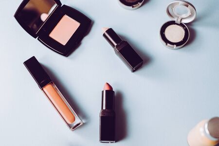 Beauty background for makeup cosmetic product on pastel light blue desktop background. top view, flat lay.の写真素材