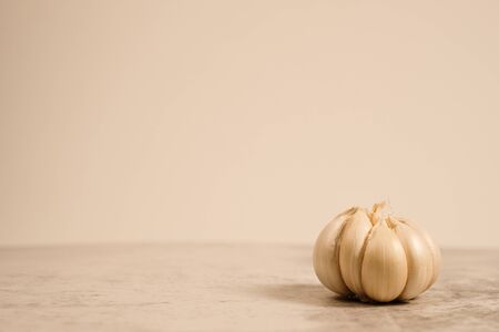 Garlic clove on stone top view .Flat lay composition with herb and nut seedの写真素材