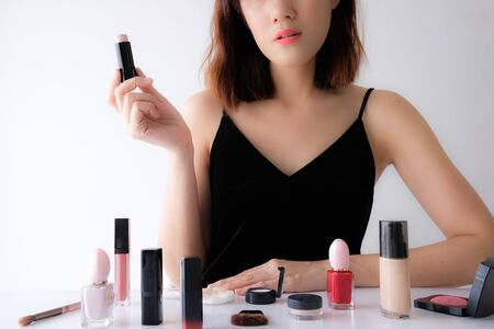 Young asian beauty blogger influencer show make up tutorial .cosmetic skincare concept for social media.の写真素材