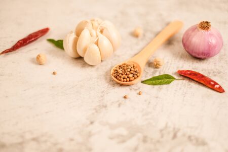 Garlic clove on stone top view .Flat lay composition with herb and nut seedの写真素材