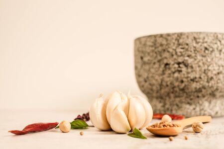 Garlic clove on stone top view .Flat lay composition with herb and nut seedの写真素材