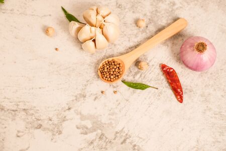 Garlic clove on stone top view .Flat lay composition with herb and nut seedの写真素材