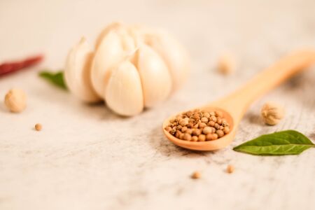 Garlic clove on stone top view .Flat lay composition with herb and nut seedの写真素材