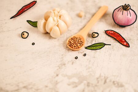 Garlic clove on stone top view Flat lay composition with herb and nut seedの写真素材