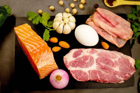 ketogenic diet, low carbohydrate and keto meal plan. nutrition and calorie count for fiber, protein and fat. weight loss program. paleo food with salmon and omega 3.の写真素材