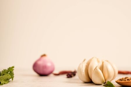 Garlic clove on stone top view .Flat lay composition with herb and nut seedの写真素材