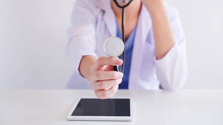 doctor with tablet using stethoscope for health care diagnosis.の写真素材