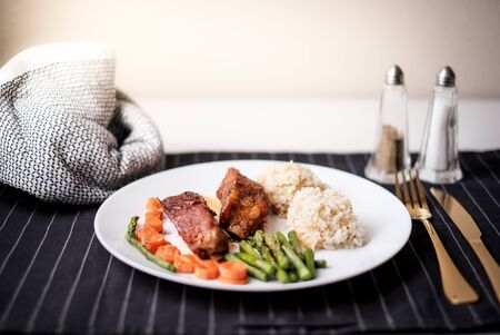 healthy eating . diet food dinner dish. pork ribs and green bean, carrot, quinoa.の写真素材