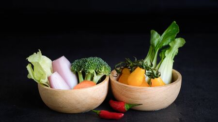 vegan and vegetarian diet healthy food. vegetable decorative on black backgroundの写真素材