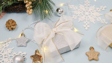 2020 Christmas and new year background banner with the beautiful decor gift for holiday in winter. On bright blue, golden and silver color theme with snow flake. top view with copy space.の写真素材